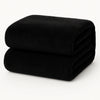Teddy fleece hoeslaken - 90x200 cm, extra warm en zacht, netjes gevouwen op een effen witte ondergrond.